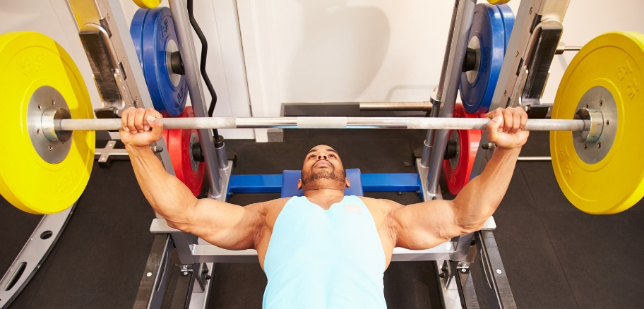 Man doing bench press exercise