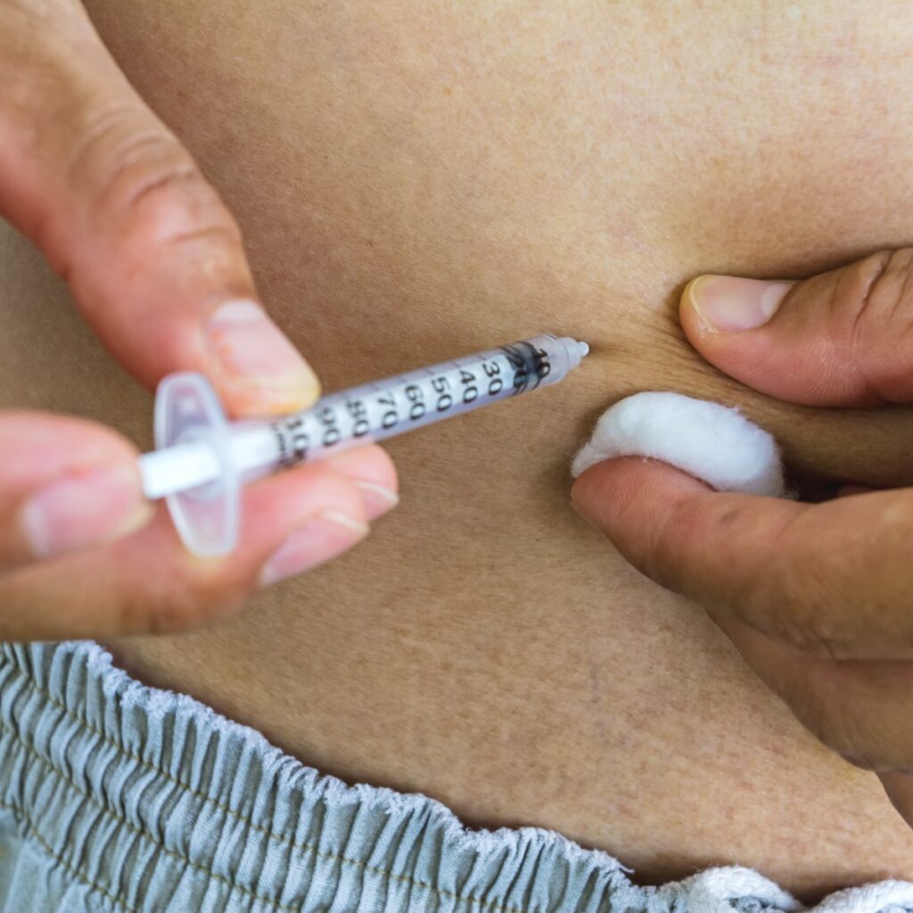 Man self-performing testosterone injection